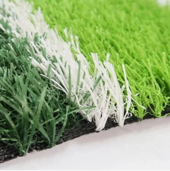 laying artificial grass on soil
